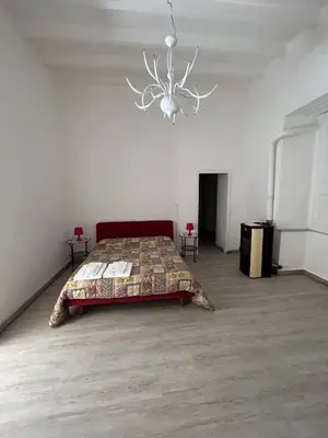 Letto o letti in una camera di Villa Bonaccorso - antica e maestosa villa con piscina ai piedi dell'Etna