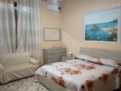 Letto o letti in una camera di Beb I Delfini Di Casa Paola