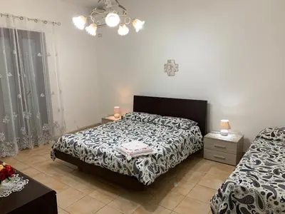 Letto o letti in una camera di Domus Grace