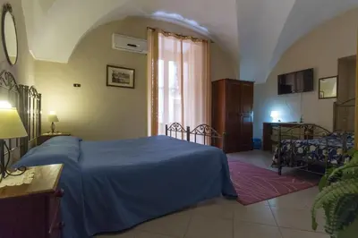 Letto o letti in una camera di Albatro Rooms