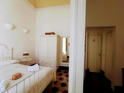 Letto o letti in una camera di Fera O' Luni
