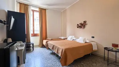 Letto o letti in una camera di Puccini Inn Catania centro