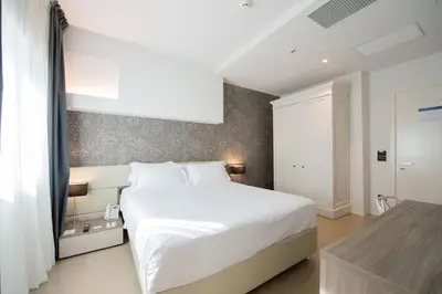 Letto o letti in una camera di Grand Hotel Faraglioni