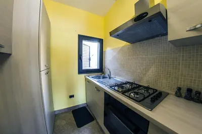 Cucina o angolo cottura di Charming house with sea view in Capo Mulini