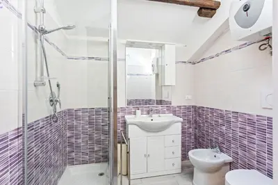 Bagno di GuestHost - Libertà Frame Apartment with Terrace and Etna view