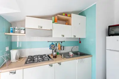 Cucina o angolo cottura di GuestHost - Libertà Frame Apartment with Terrace and Etna view