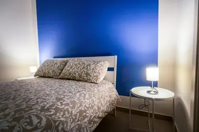 Letto o letti in una camera di Casa del Forestiero Umberto