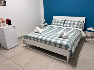 Letto o letti in una camera di Casa del Forestiero Umberto