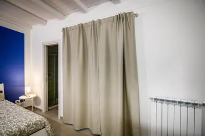 Letto o letti in una camera di Casa del Forestiero Umberto