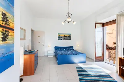 Letto o letti in una camera di GuestHost - La Finestra dei Ciclopi Seaview Flat