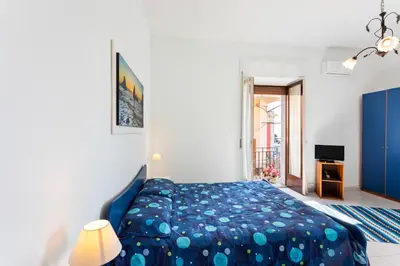Letto o letti in una camera di GuestHost - La Finestra dei Ciclopi Seaview Flat
