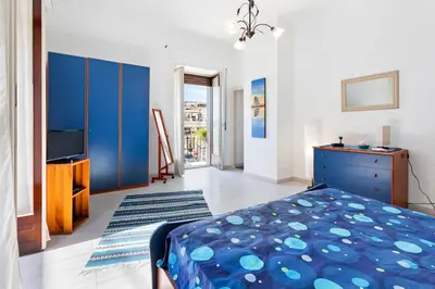Letto o letti in una camera di GuestHost - La Finestra dei Ciclopi Seaview Flat