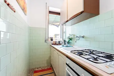 Cucina o angolo cottura di GuestHost - La Finestra dei Ciclopi Seaview Flat