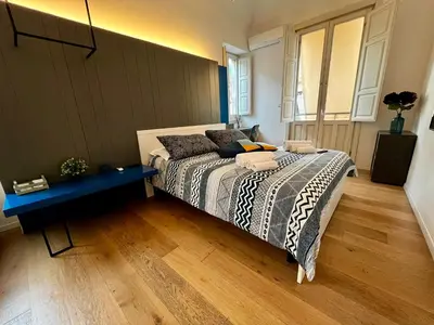 Letto o letti in una camera di Dimora del Mercante
