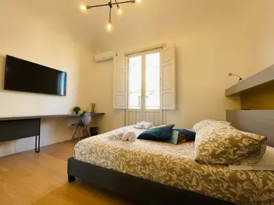 Letto o letti in una camera di Dimora del Mercante