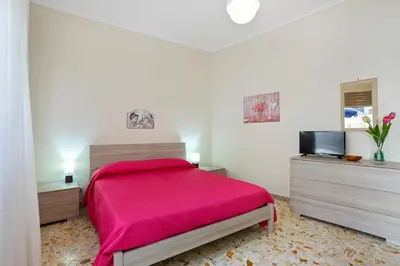 Letto o letti in una camera di GuestHost - Tra il Centro e il Mare Apartment con terrazzo