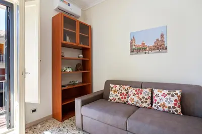 Area soggiorno di GuestHost - Tra il Centro e il Mare Apartment con terrazzo