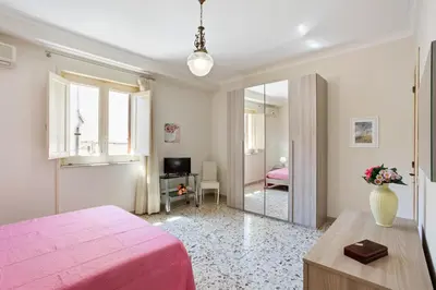 Letto o letti in una camera di GuestHost - Tra il Centro e il Mare Apartment con terrazzo