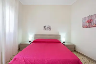 Letto o letti in una camera di GuestHost - Tra il Centro e il Mare Apartment con terrazzo