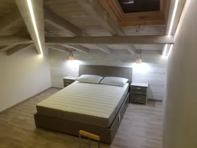 Letto o letti in una camera di LISA HOUSE