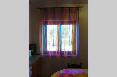 Letto o letti in una camera di Marianna's house for your holidays (near Taormina)