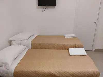 Letto o letti in una camera di B&B Carpe Diem