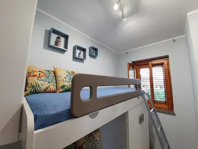Letto o letti in una camera di NEW PANORAMA