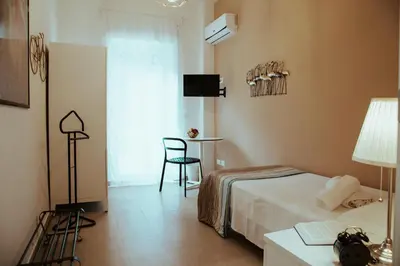 Letto o letti in una camera di SoStanza - Rooms in Catania