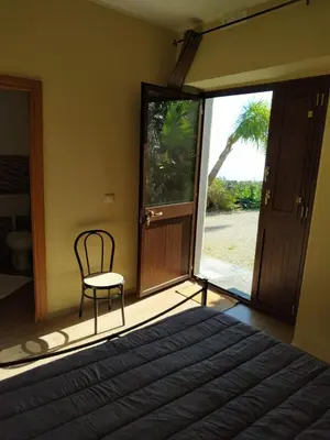 Letto o letti in una camera di Tenuta la Timpa Vela rooms And pool