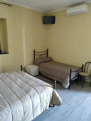 Letto o letti in una camera di Tenuta la Timpa Vela rooms And pool