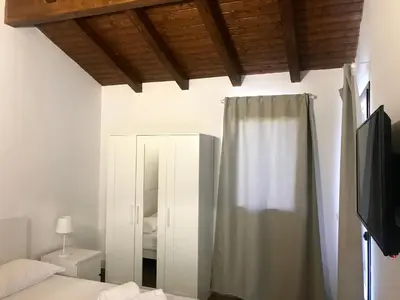Letto o letti in una camera di Agricampeggio Verde Etna