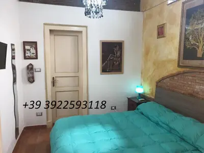 Letto o letti in una camera di Bellavista