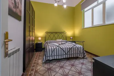Letto o letti in una camera di Fermata Jonia
