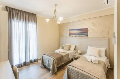 Letto o letti in una camera di Oasi Perla Del Mare Rooms