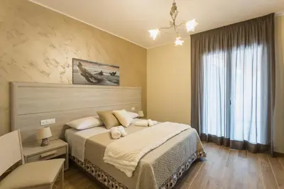 Letto o letti in una camera di Oasi Perla Del Mare Rooms