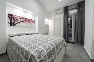 Letto o letti in una camera di ReyHome Santa Filomena