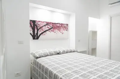 Letto o letti in una camera di ReyHome Santa Filomena
