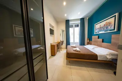 Letto o letti in una camera di CATANIA LIVING ROOMS