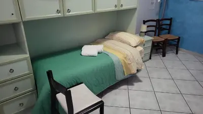 Letto o letti in una camera di Grotta del Monaco