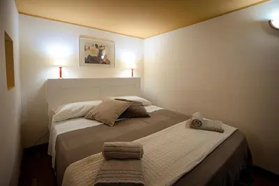 Letto o letti in una camera di Catania Amuri Home