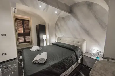 Letto o letti in una camera di Suite Vico li cuti