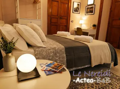 Letto o letti in una camera di Le Nereidi b&b Acireale Centro