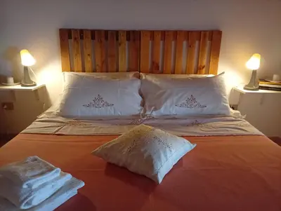 Letto o letti in una camera di Casi Home