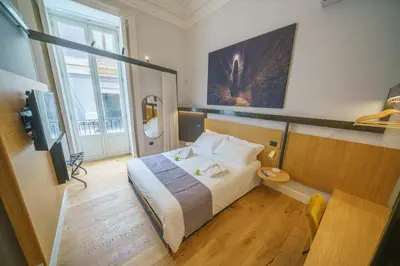 Letto o letti in una camera di Cafuné Rooms