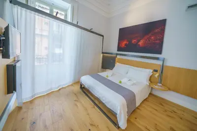 Letto o letti in una camera di Cafuné Rooms