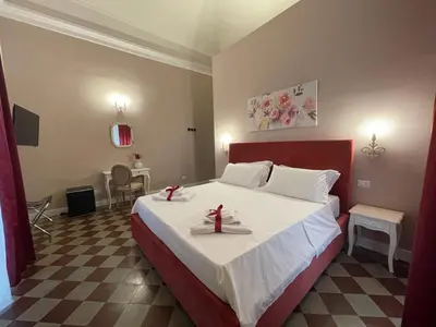 Letto o letti in una camera di B&B Romeo Luxury Rooms