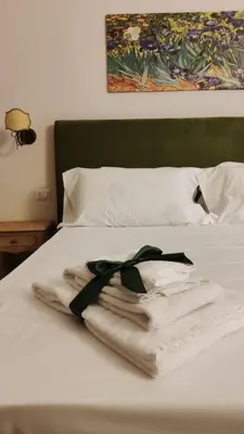 Letto o letti in una camera di B&B Romeo Luxury Rooms
