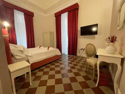 Letto o letti in una camera di B&B Romeo Luxury Rooms