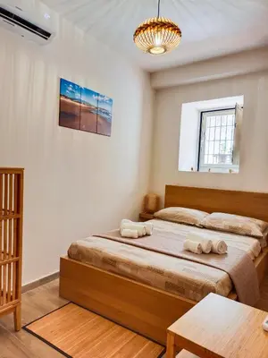 Letto o letti in una camera di EtnaCiTy Guest House Apartment