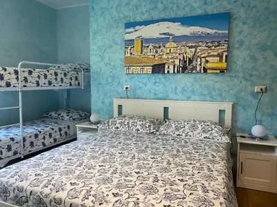 Letto o letti in una camera di B&B CATANIA CENTRO - Charme & More